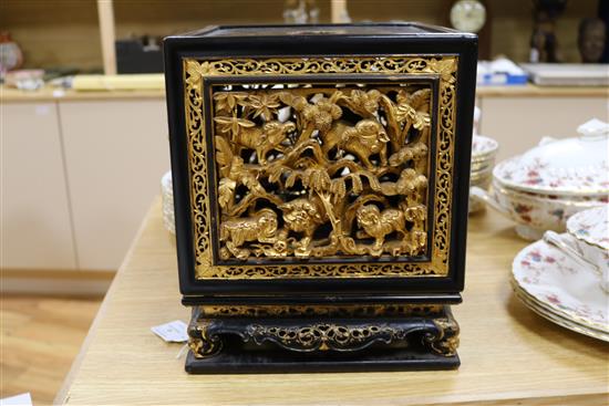 A late 19th/early 20th century Chinese giltwood and black lacquer incense stand